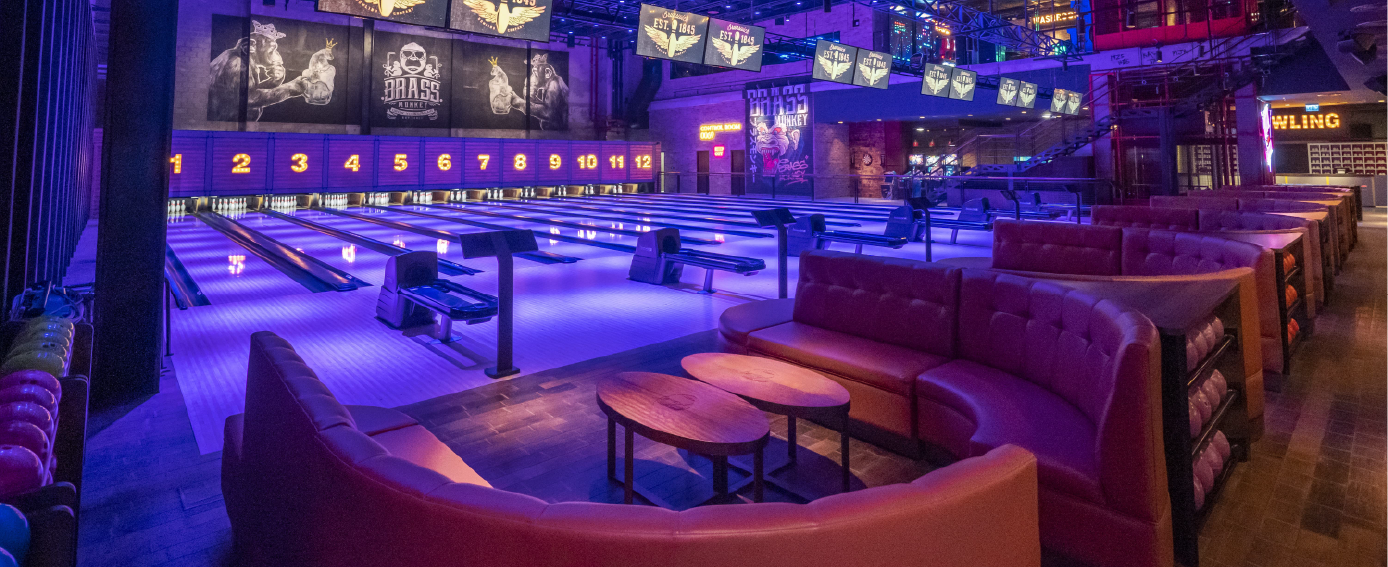 bowling sofas and furniture in a blacklit bowling alley